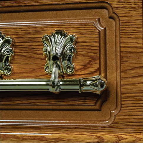 Brass bar handle set within a traditional framed panel on the oak veneered side of The Chatsworth
