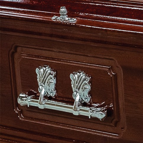 Chrome bar handle set within a traditional framed panel on the side of The Stanton mahogany casket